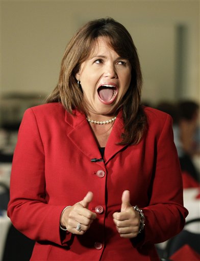 Republican Senate candidate Christine O'Donnell jokes with a supporter while waiting to be interviewed at her election night party, Tuesday, Sept. 14, 2010, in Dover, Del. O'Donnell is in a Republican primary battle with Rep. Mike Castle for the U.S. Senate seat in Delaware. (AP Photo/Rob Carr) (AP)
