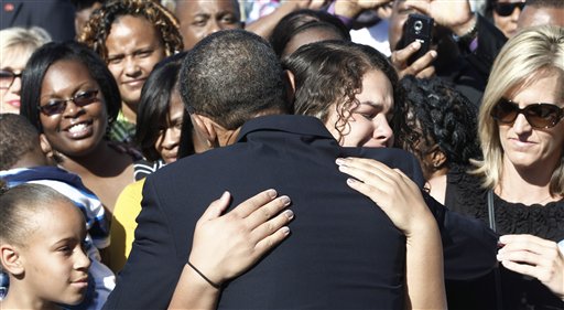 President Barack Obama hugs an unidentified woman as he greets family members of victims after speaking at the Pentagon Memorial, marking the ninth anniversary of the September 11 attacks, Saturday, Sept. 11, 2010. (AP Photo/Charles Dharapak) (AP)