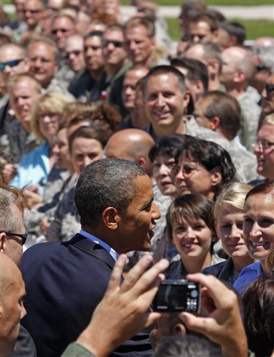 FILE - In this June 30, 2010 file photo, President Barack Obama greets members of the Wisconsin National Guards 128th Air Refueling Wing upon his arrival at Mitchell International airport in Milwaukee, Wis. When President Barack Obama makes his third Wisconsin visit in a little over two months Monday, he will get a chance to shore up his base at a Labor Day rally in a state where his approval ratings are dipping and fellow Democrats face tough re-election bids.  (AP Photo/Jeffrey Phelps, File) (AP)