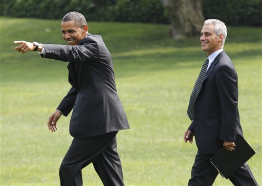 President Barack Obama points to visitors singing "Happy Birthday" to him as he walks with White House chief of staff Rahm Emanuel towards Marine One helicopter on the South Lawn of the White House in Washington, Wednesday, Aug. 4, 2010, prior to traveling to Chicago. (AP Photo/Charles Dharapak) (AP)