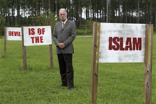 In this photo taken Monday, Aug. 30, 2010,  Rev. Terry Jones poses for a photo at the Dove World Outreach Center in Gainesville, Fla. Jones vowed to go ahead with plans to burn copies of the Quran to protest the Sept. 11 terrorist attacks despite warnings from the White House and the top U.S. general in Afghanistan that doing so would endanger American troops overseas. (AP Photo/John Raoux) (AP)
