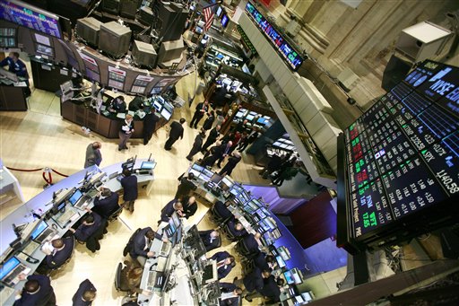 FILE - In this March 8, 2010 file photo, the semi-circular trading desk, lower left, of Cuttone & Co., is seen at the New York Stock Exchange. Stock futures inched lower Tuesday, Sept. 14, 2010, as investors put a rally on hold ahead of a new report on retail sales. (AP Photo/Mark Lennihan, file) (AP)