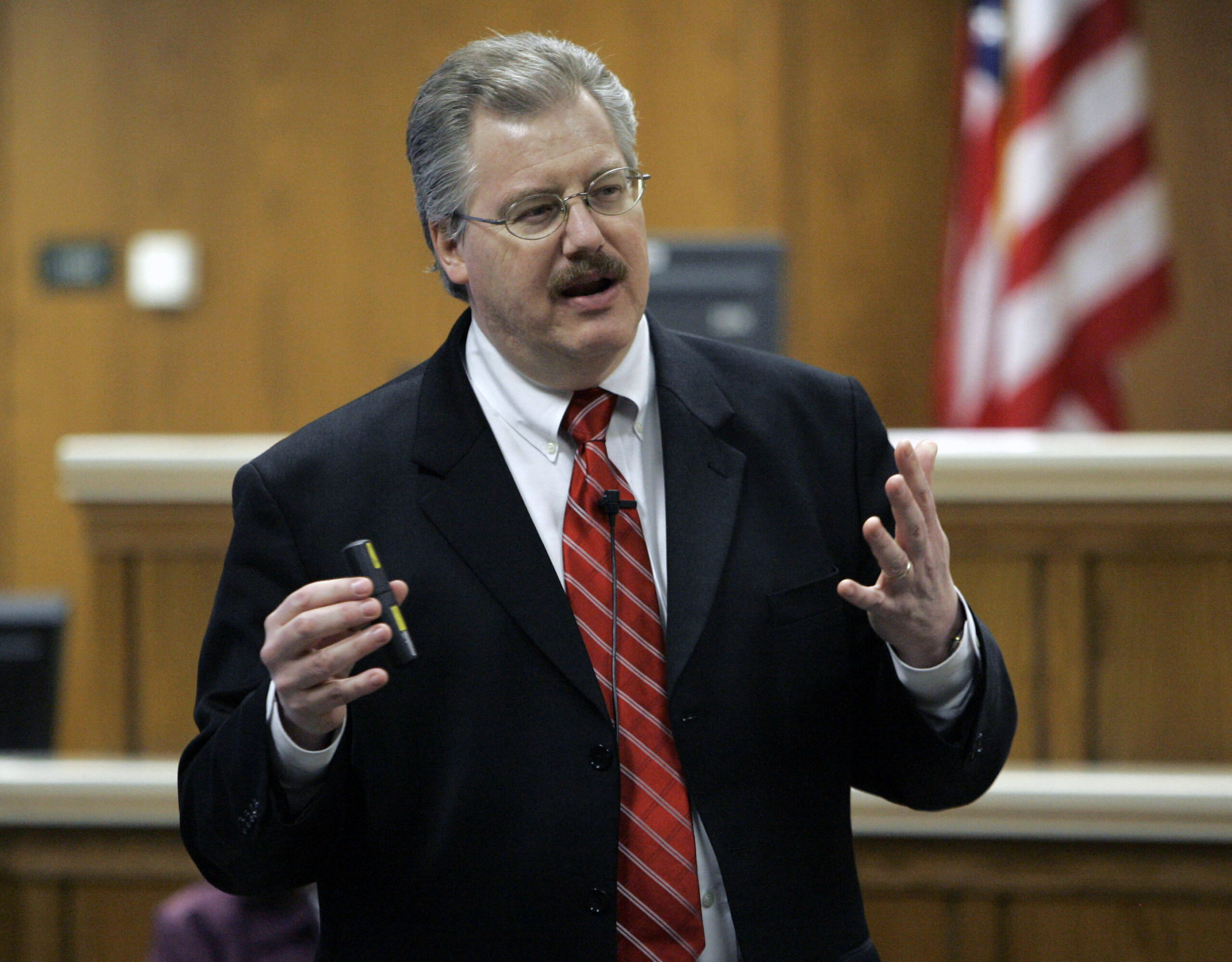 ** FILE **This March 2007 file photo shows Calumet County District Attorney Kenneth Kratz giving his closing argument in the Steven Avery trial in the courtroom in Chilton, Wis. Police say Kratz sent repeated text messages trying to spark an affair with a domestic abuse victim while he was prosecuting her ex-boyfriend. (AP Photo/Morry Gash) (Morry Gash)