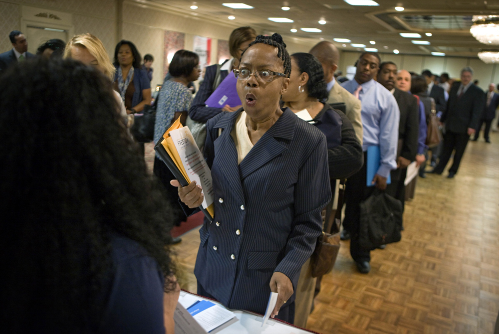 Dabura Karriem, 60, of Bloomfield, N.J., reacts upon hearing there is a job available for exactly what she's looking for as a file clerk at a bank, while attending a career fair in Newark, N.J., Tuesday, Aug. 24, 2010. Karriem's unemployment benefits have expired after being laid off two years ago, the first time she's been unemployed in 38 years. The government on Friday Aug. 27, 2010 is about to confirm what many people have felt for some time: The economy barely has a pulse.  Many analysts say the uncertainty surrounding the economy is holding back consumers from spending and companies from investing and hiring. (AP Photo/David Goldman) (David Goldman)