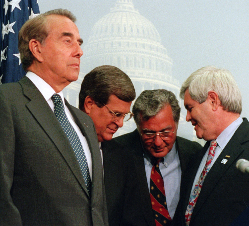 House Speaker Newt Gingrich of Ga., right, huddles with, from second from right, House Majority Leader Dick Armey of Texas, Senate Majority Whip Trent Lott of Miss., and Senate Majority Leader Bob Dole of Kan., during a Capitol Hill news conference in this Sept. 6, 1995 photo.  (AP Photo/John Duricka) (John Duricka)