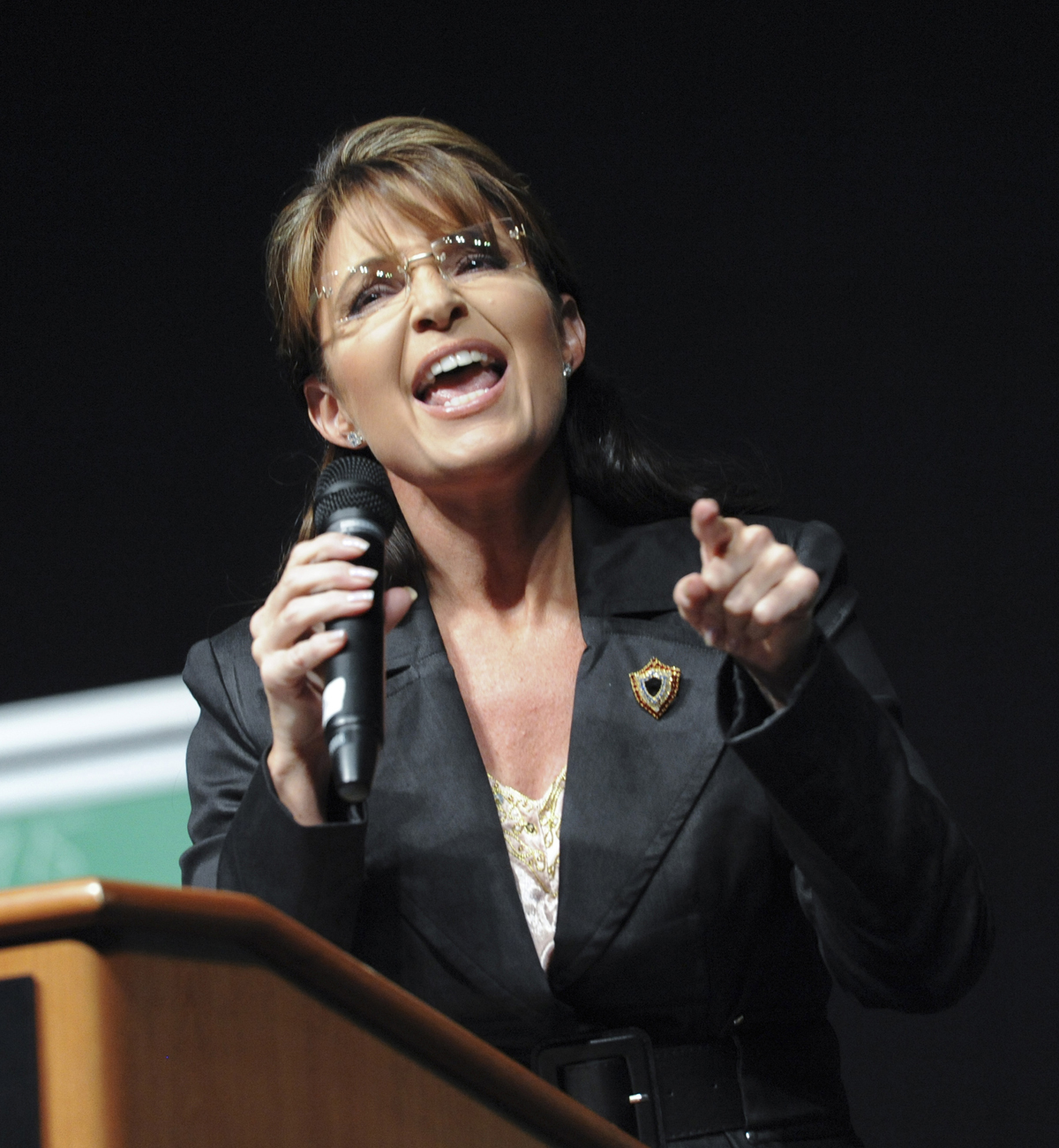 Former Alaska governor Sarah Palin warms up the crowd for political commentator Glenn Beck at an appearance in Anchorage, Alaska Saturday, Sept. 11, 2010. The event featuring the former Alaska Gov. and the conservative commentator Saturday night brought out two very different crowds.   (AP Photo/Michael Dinneen) (Michael Dinneen)
