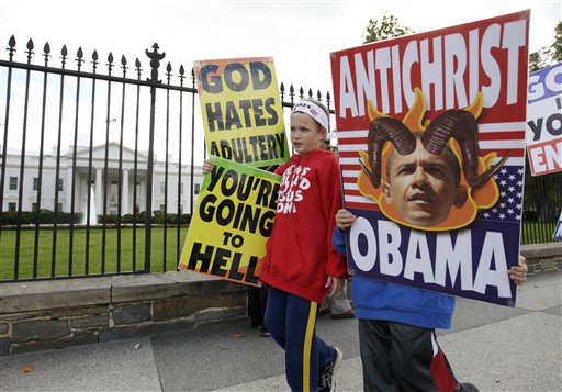Members of the Westboro Baptist Church, Luke Phelps-Roper, 8, left, and Seth Phelps, 9, both from Topeka, Kansas, picket outside the White House in Washington, Tuesday, Oct. 5, 2010. (AP Photo/Carolyn Kaster) (AP)