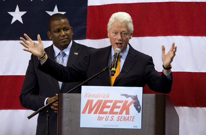 Florida Democratic senate candidate Kendrick Meek, left, listens to former President Bill Clinton address supporters during a campaign rally for Meek Tuesday, Oct. 19, 2010 in St. Petersburg, Fla. (AP Photo/Steve Nesius) (Steve Nesius)