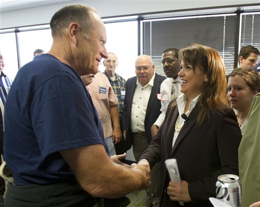Delaware Republican Senate candidate Christine O'Donnell, right, greets supporters during a rally, Friday, Oct. 1, 2010, at her new campaign headquarters in Wilmington, Del. (AP Photo/Rob Carr) (AP)
