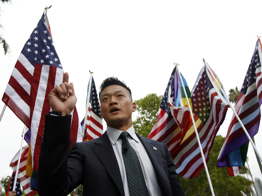 Lieutenant Dan Choi, who was recently dismissed from the U.S. Army for admitting he was gay, speaks during a rally outside the Beverly Hilton hotel, where U.S. President Barack Obama was attending a Democratic party fundraiser, in Beverly Hills, California May 27, 2009. California's supreme court backed a ban on gay marriage on Tuesday, upholding the voter-approved Proposition 8 defining marriage as between a man and a woman, but said the marriages last year of 18,000 same sex couples were still legal. REUTERS/Mario Anzuoni   (UNITED STATES POLITICS CONFLICT) (Â© Mario Anzuoni / Reuters)