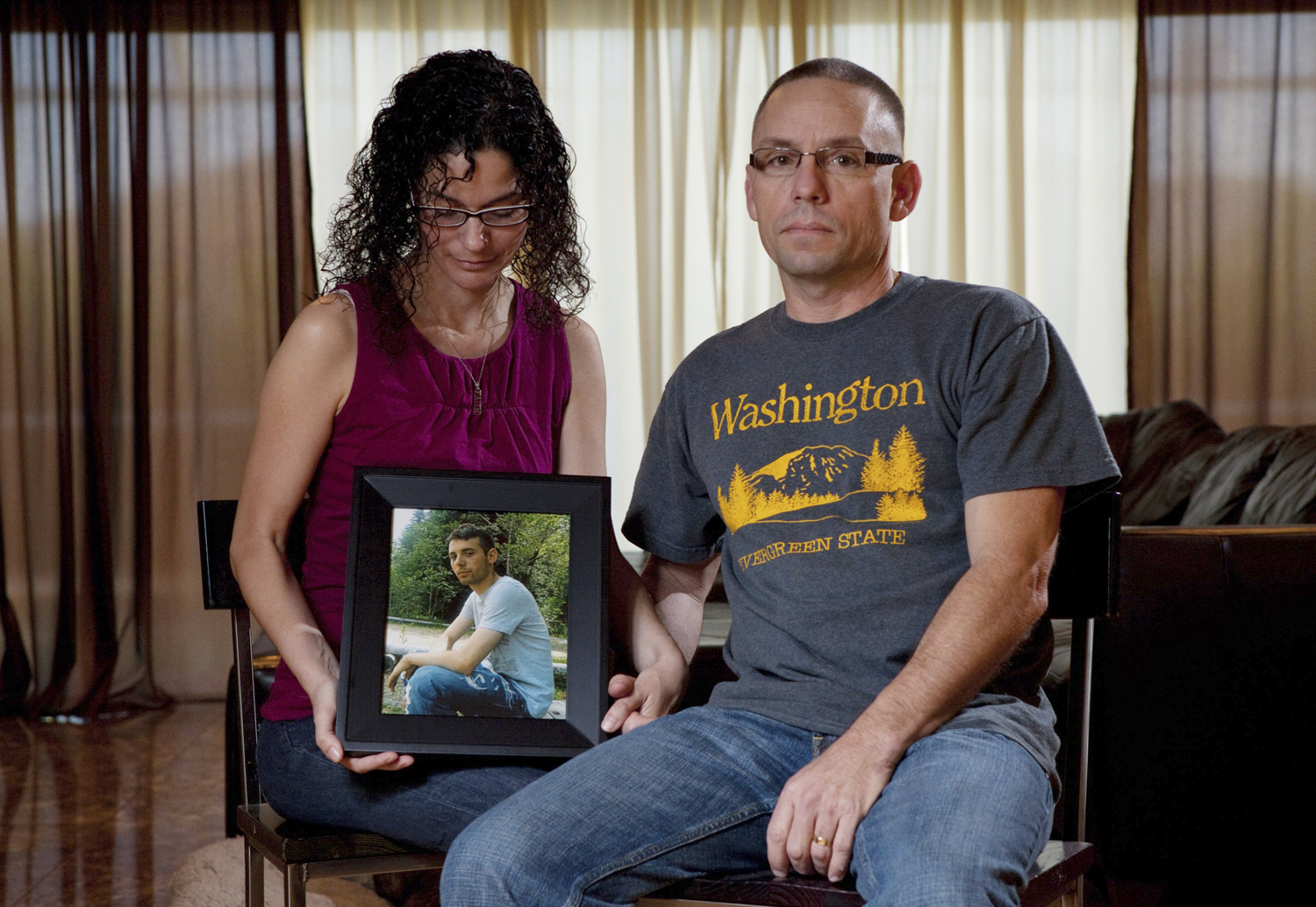 Emma and Christopher Winfield hold a photograph of their son, 22-year-old U.S. Army Spc. Adam Winfield, at their home in Cape Coral, Fla.,  Friday, Sept. 3, 2010. Adam is accused of murdering civilians during his deployment to Afghanistan, a charge he and his family firmly refute.  (AP Photo/Erik Kellar) (Erik Kellar)