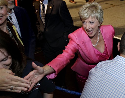 Republican candidate for U.S. Senate Linda McMahon, a former wrestling executive, reaches into the crowd to shake hands with supporters during her campaign party after winning the Republican primary in Cromwell, Conn., Tuesday, Aug. 10, 2010. (AP Photo/Charles Krupa) (AP)