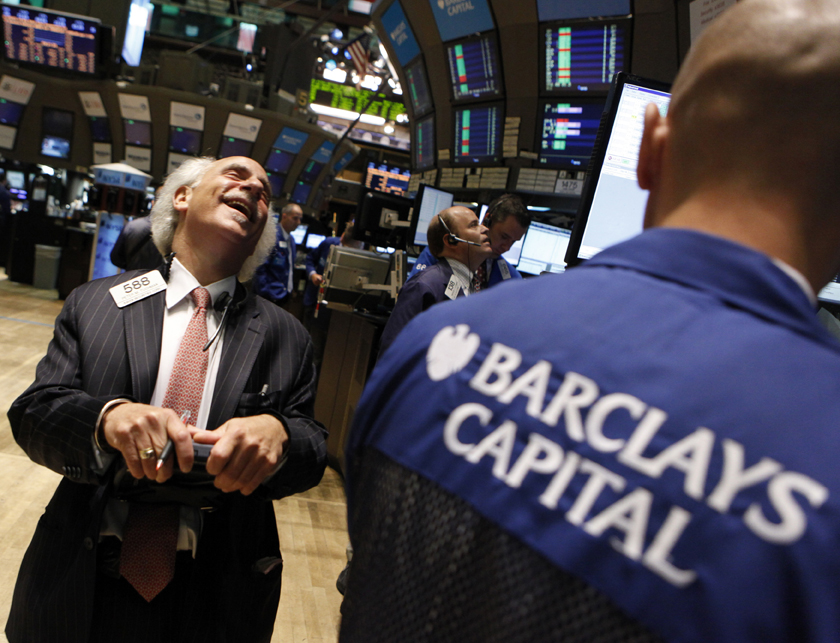 Trader Peter Tuchman shares a laugh with a specialist trader from Barclays Capital on the floor of the New York Stock Exchange June 11, 2010. U.S. stocks rose in a late rally on Friday as a strong forecast from a chip maker lifted tech shares and helped alleviate concerns about the economy's health after an unexpected drop in retail sales.        REUTERS/Brendan McDermid (UNITED STATES - Tags: BUSINESS IMAGES OF THE DAY) (Â© Brendan Mcdermid / Reuters)