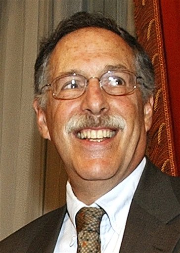 FILE -- In a June 18, 2004 file photo Professor Peter A. Diamond smiles prior to the start of a meeting at Rome's Bank of Italy headquarters, Americans Peter Diamond and Dale Mortensen and Christopher Pissarides, a British and Cypriot citizen, have won the 2010 Nobel economics prize. (AP Photo/Gregorio Borgia/file) (AP)