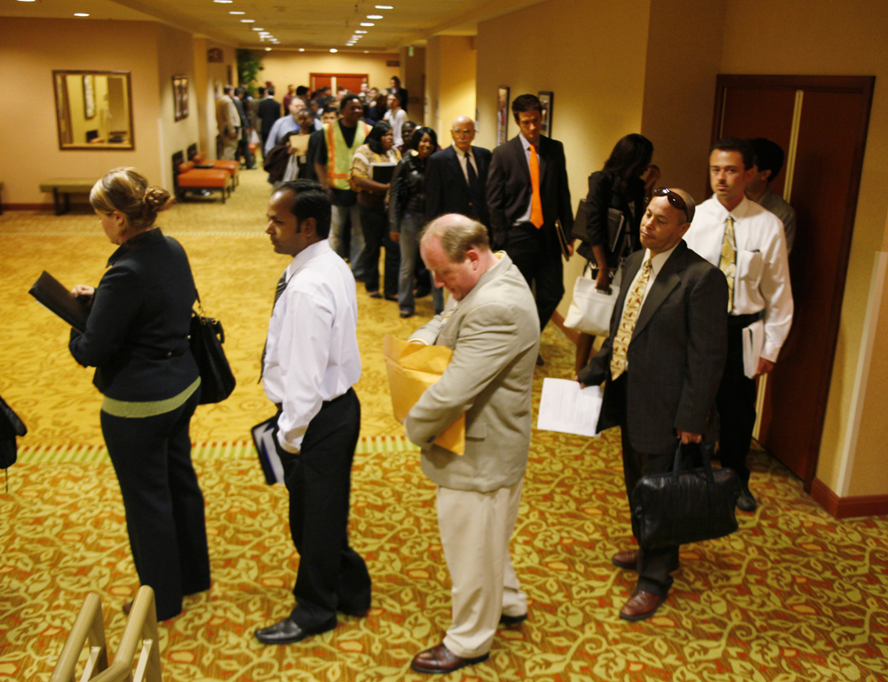 In this photo taken June 28, 2010, job seekers wait in line to register and attend a National Career Fair in San Francisco. Initial claims for unemployment benefits rose for the second time in three weeks last week, a sign that layoffs are rising. (AP Photo/Eric Risberg) (Eric Risberg)