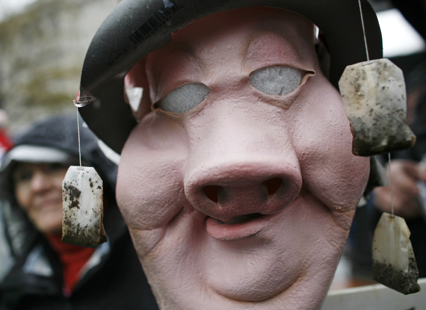 A woman participates in a rally as part of national Tax Day in Lafayette Park across from the White House in Washington, April 15, 2009. The tea bags represent the rebellion of the Boston tea party. REUTERS/Jim Young    (UNITED STATES BUSINESS CONFLICT) (Â© Jim Young / Reuters)