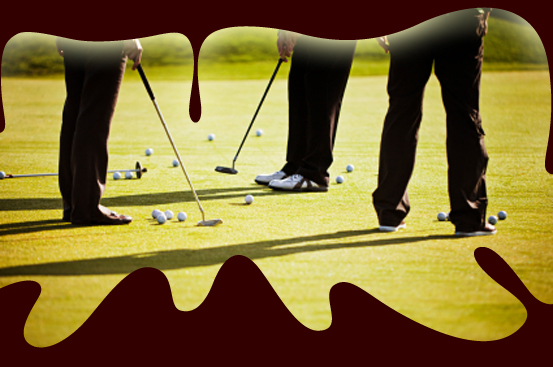 Golf course. Instructor is putting ball into hole. (Matjaz Boncina)