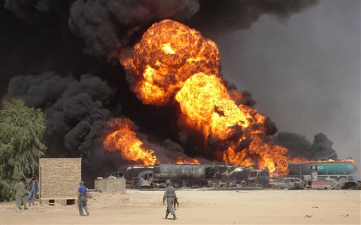 FILE - In this Tuesday, Sept 11, 2007 file picture, plumes of fire and smoke fill the sky after a suicide car bomb explosion which hit fuel tanker trucks on the main highway of Helmand province, south of Kabul, Afghanistan. (AP Photo/Abdul Khaleq, File) (AP)