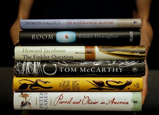 The six books shortlisted for the 2010 Man Booker Prize are held at a photocall on the stage of the Royal Festival Hal in London, Sunday, Oct. 10, 2010. The winner will be announced on Tuesday, Oct. 12 at a dinner at London's Guildhall. (AP Photo/Kirsty Wigglesworth) (AP)