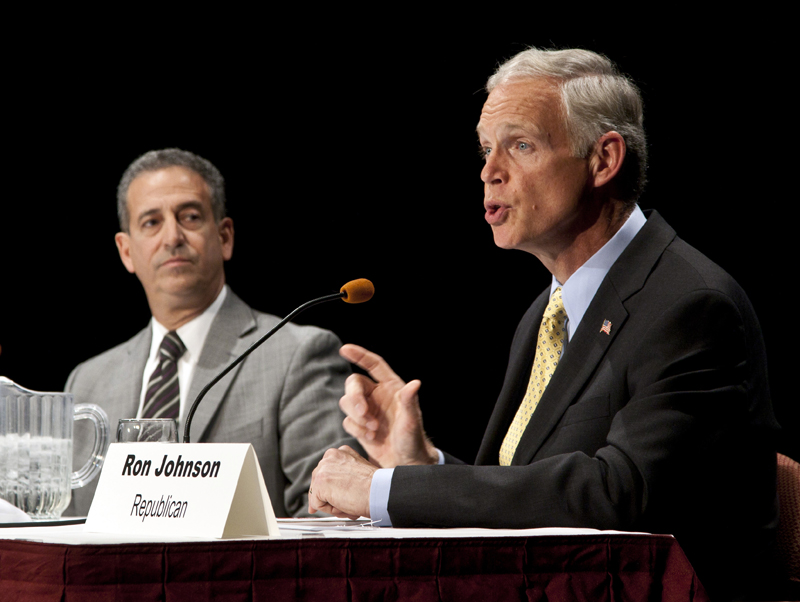 Wisconsin senatorial candidates Democrat Sen. Russ Feingold, left, and Republican Ron Johnson participate in a debate Monday, Oct. 11, 2010, in Wausau, Wis. (AP Photo/Morry Gash) (Morry Gash)
