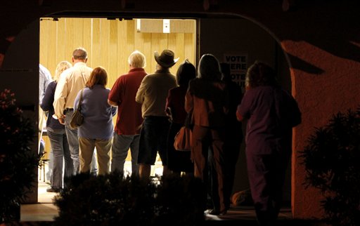 Voters line up to vote before sunrise on election day Tuesday, Nov. 2, 2010, in Apache Junction, Ariz. (AP Photo/Ross D. Franklin) (AP)