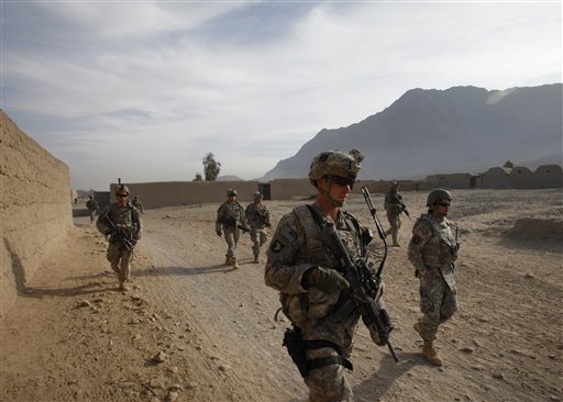 Second Lt. Jonathan Rezendes of Mass., foreground, and other U.S. soldiers from First Battalion, 502nd Infantry Regiment, 101st Airborne Division patrol in West Now Ruzi village, in Panjwai district, Afghanistan, Sunday, Nov. 21, 2010.(AP Photo/Alexander Zemlianichenko) (AP)