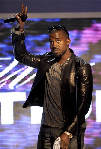 FILE - In this June 11, 2009 file photo, Kanye West performs for the Kanye West Foundation at the Chicago Theatre in Chicago. (AP Photo/Paul Beaty, file) (AP)