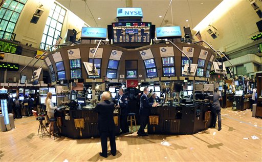 In this photo taken Sept. 21, 2010, trading continues on the floor of the New York Stock Exchange in New York. Stock futures edged lower Wednesday, Sept. 22, as traders turned to buying Treasury's and gold after the Federal Reserve failed to take any immediate steps to help the economy.(AP Photo/Henny Ray Abrams) (AP)