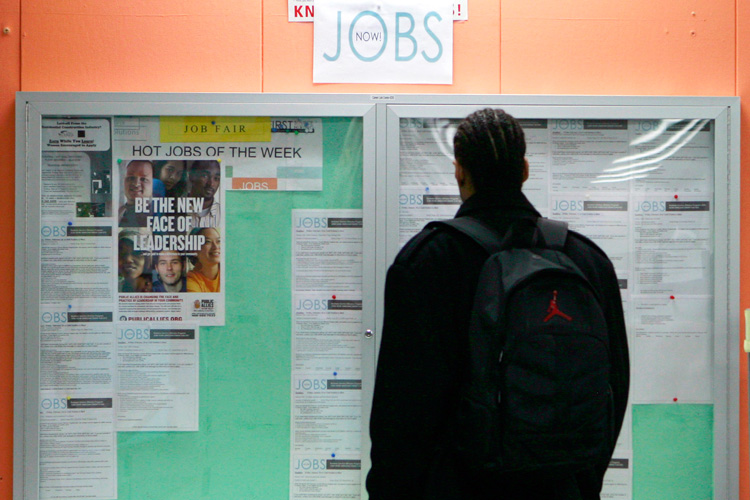 A man looks over employment opportunities at a jobs center in San Francisco.