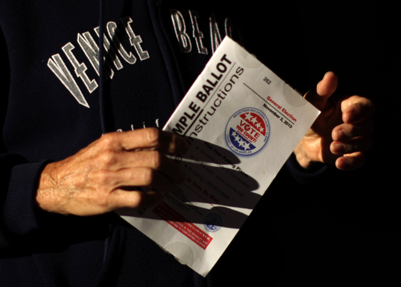 A woman arrives to vote at a polling place on Venice Beach in Los Angeles, California, November 2, 2010. After a long and bitter campaign, Americans cast their votes on Tuesday in elections that could sweep Democrats from power in Congress and slam the brakes on President Barack Obama's legislative agenda. REUTERS/Lucy Nicholson (UNITED STATES - Tags: POLITICS ELECTIONS) (Â© Lucy Nicholson / Reuters)