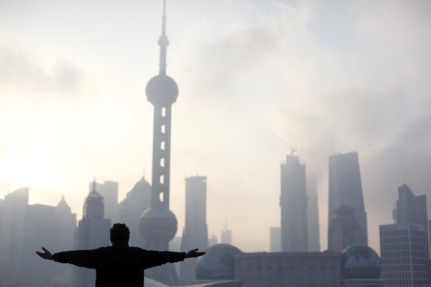 A man practices Tai Chi during an early morning session at the Bund, on the banks of the Huangpu River, following its reopening after a massive renovation for the upcoming Shanghai World Expo 2010 in Shanghai March 29, 2010. Shanghai underwent a massive facelift for the coming Shanghai World Expo due to start on May 1, 2010. The Oriental Pearl tower is seen in the background. REUTERS/Nir Elias (CHINA - Tags: BUSINESS SOCIETY IMAGES OF THE DAY) (Â© Nir Elias / Reuters)