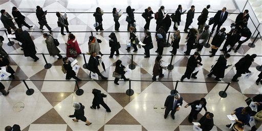 FILE - In this March 20, 2009 file photo, a line of job applicants snakes through a rope-line to attend the CUNY Big Apple Job Fair, in New York. In the previous survey in July, the economists predicted unemployment of 8.7 percent at the end of next year. In the survey before that, they foresaw 8.4 percent. Some now think unemployment won't drop to a historically normal 5.5 percent to 6 percent until at least 2018 _ several years later than envisioned earlier.(AP Photo/Mark Lennihan, file) (AP)