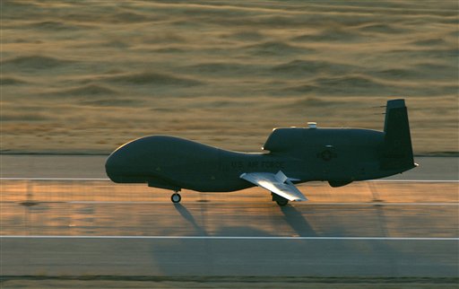 FILE - In this Nov. 3, 2006, file photo provided by the US Air Force shows an RQ-4 Global Hawk Unmanned Aerial Vehicle (UAV) landing at Beale Air Force Base, Calif. The Air Force is basing three of its most advanced unmanned aerial vehicles, the Global Hawk to Guam. (AP Photo/US Air Force, John Schwab, File) (AP)