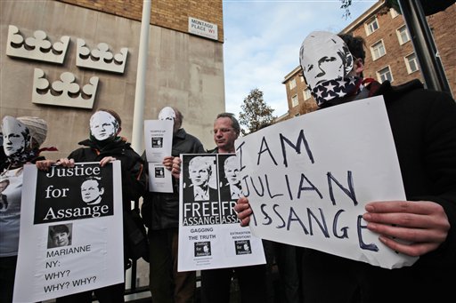 Supporters of WikiLeaks founder Julian Assange, some wearing masks depicting him and holding placards participate at a demonstration outside the Swedish Embassy In central London, Monday, Dec. 13, 2010. Assange remains in a U.K. jail ahead of a Dec. 14 hearing where he plans to fight Sweden's request to extradite him to face sex crimes allegations there. Marianne Ny, named on poster, is the Swedish Director of Public Prosecution.  (AP Photo/Lefteris Pitarakis) (AP)