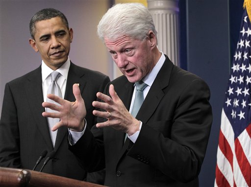 President Barack Obama looks on as former President Bill Clinton speaks in the briefing room of the White House in Washington, Friday, Dec. 10, 2010. (AP Photo/J. Scott Applewhite) (AP)