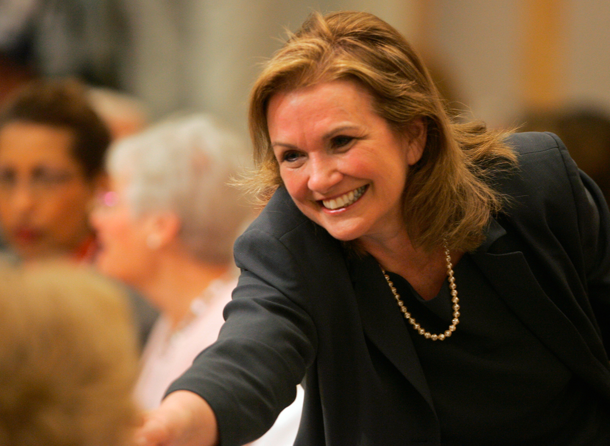 In this March 26, 2007 file photo, Elizabeth Edwards greets audience members after arriving for a speech in Cleveland.