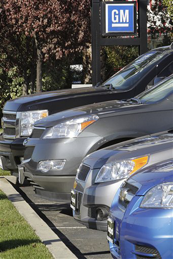 In this Nov. 29, 2010 photo, a row of GM vehicles are displayed at a GM dealership in Redwood City, Calif. Sales of General Motors cars and trucks rose 11 percent last month, a sign that the auto industry's slow recovery is gaining traction.(AP Photo/Paul Sakuma) (Paul Sakuma)