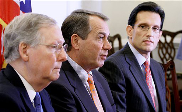 House Minority Leader John Boehner of Ohio, center, accompanied by Senate Minority Leader Mitch McConnell of Ky., left, and House Minority Whip Eric Cantor of Va. speaks during a news conference on Capitol Hill in Washington, Tuesday, Nov. 30, 2010, after their meeting with President Barack Obama. (AP Photo/Harry Hamburg) (Harry Hamburg)