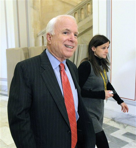 Sen. John McCain, R-Ariz., the ranking  member of the Senate Armed Services Committee, walks on Capitol Hill in Washington Tuesday, Nov. 30, 2010, as committee staff members are receiving a briefing on the Armed Services Don't Ask Don't Tell survey. (AP Photo/Alex Brandon) (AP)