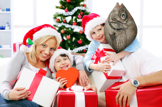 Happy family with Santa hats holding many Christmas gifts, smiling and looking at camera.