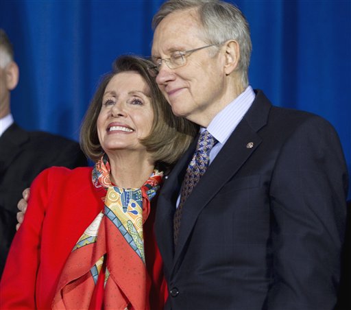 Senate Majority Leader Harry Reid of Nev., right, hugs House Speaker Nancy Pelosi of Calif., during a signing ceremony for "don't ask, don't tell" repeal legislation that would allow gays to serve openly in the military, Wednesday, Dec. 22, 2010, at the Interior Department in Washington.  (AP Photo/Evan Vucci) (AP)