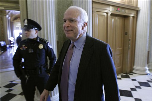 Sen. John McCain, R-Ariz., walks near the floor of the Senate on Capitol Hill in Washington Saturday, Dec. 18, 2010, during a rare Saturday session to finish the year's legislative business. Senators planned a procedural vote Saturday on a bill to end the Pentagon's "don't ask, don't tell" policy for gays in the military. (AP Photo/Alex Brandon) (AP)