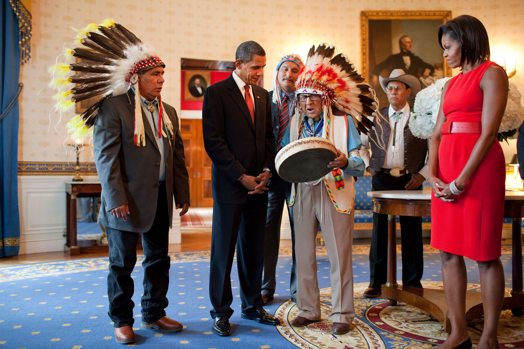 Presidential Medal of Freedom recipient Joseph Medicine Crow shows a drum to President Barack Obama and First Lady Michelle Obama during a reception for recipients and their families in the Blue Room of the White House, August 12, 2009.  (Official White House photo by Pete Souza)

This official White House photograph is being made available only for publication by news organizations and/or for personal use printing by the subject(s) of the photograph. The photograph may not be manipulated in any way and may not be used in commercial or political materials, advertisements, emails, products, promotions that in any way suggests approval or endorsement of the President, the First Family, or the White House. (The White House)