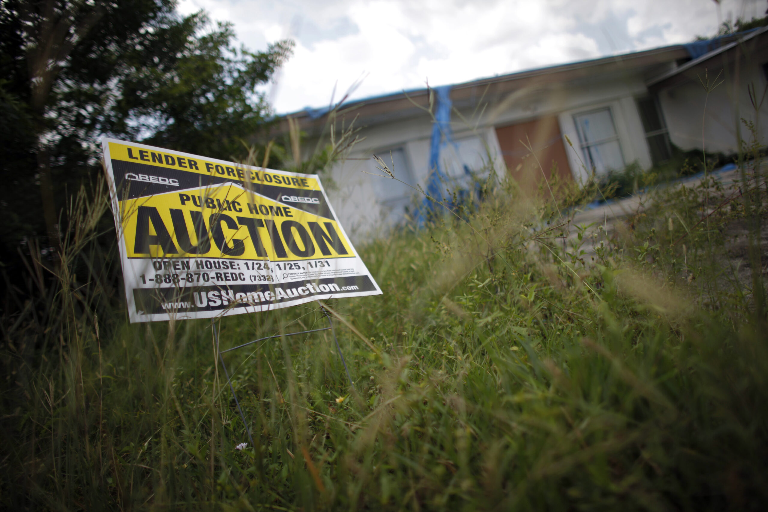 An auction sign for a property is seen at the front garden of a foreclosed house in Miami Gardens, Florida in this September 15, 2009 file photo. There are more than 6,600 home foreclosure filings per day, according to the Center for Responsible Lending, a nonpartisan watchdog group based in Durham, North Carolina. With nearly two million already this year, the flood of foreclosures shows no sign of abating any time soon. To match feature USA-HOUSING/FORECLOSURES   REUTERS/Carlos Barria/Files (UNITED STATES POLITICS BUSINESS) (Reuters)