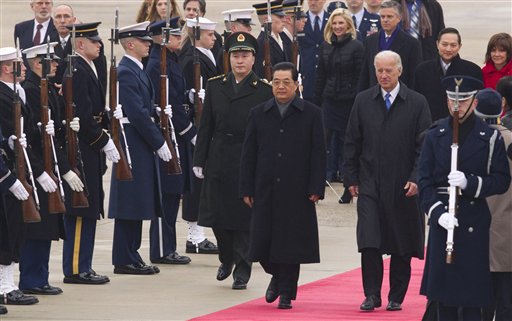 Chinese President Hu Jintao and Vice President Joe Biden walk the red carpet upon the president's arrival, Tuesday, Jan. 18, 2011, at Andrews Air Force Base, Md. (AP Photo/Evan Vucci) (AP)