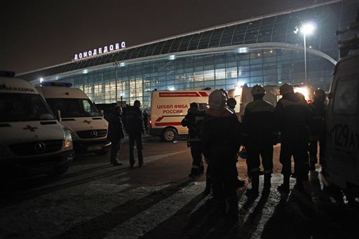 Ambulance vehicles and emergency workers are seen in front of Domodedovo airport in Moscow, Monday, Jan. 24, 2011. An explosion ripped through the international arrivals hall at Moscow's busiest airport on Monday, killing dozens of people and wounding scores, officials said. The Russian president called it a terror attack. (AP Photo/Alexander Zemlianichenko) (AP)