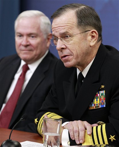 Defense Secretary Robert Gates, left, and Joint Chiefs Chairman Adm. Mike Mullen talk to the media about defense budget cuts, Thursday, Jan. 6, 2011, at the Pentagon. (AP Photo/Alex Brandon) (AP)