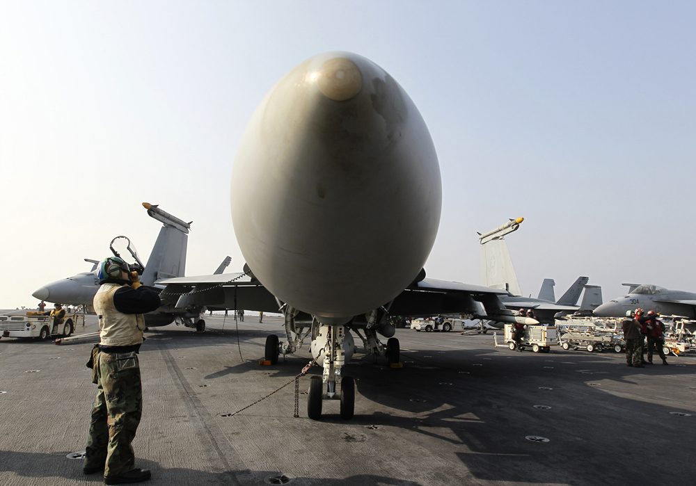 An F/A-18 Hornet fighter jet sits onboard the U.S. Navy's USS George Washington aircraft carrier. (Reuters)