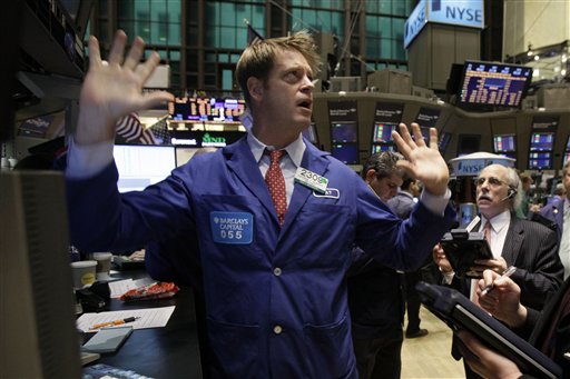 Specialist Patrick Murphy, left, works at his post on the floor of the New York Stock Exchange Tuesday, Jan. 25, 2011. (AP Photo/Richard Drew) (AP)