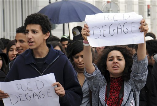 Students demonstrate, some carrying posters reading "RCD get out",  in Tunis, Thursday Jan. 27, 2011. A government official says Tunisia's prime minister is expected to announce the country's second interim government since the ouster of the former dictator. Protesters are demanding that the new government not include members of the Ben Ali's party, the RCD. (AP Photo/Hassene Dridi) (AP)